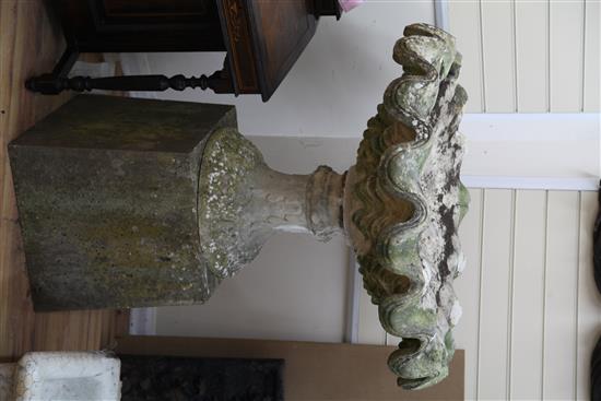 A large weathered stone garden urn, W.3ft 5in. H.3ft 11in.